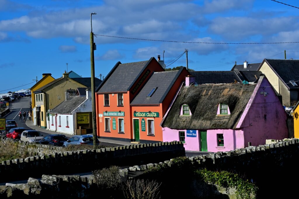 pexels photo 15976480 15976480 Charming colorful buildings along a vibrant street in Doolin, Ireland.