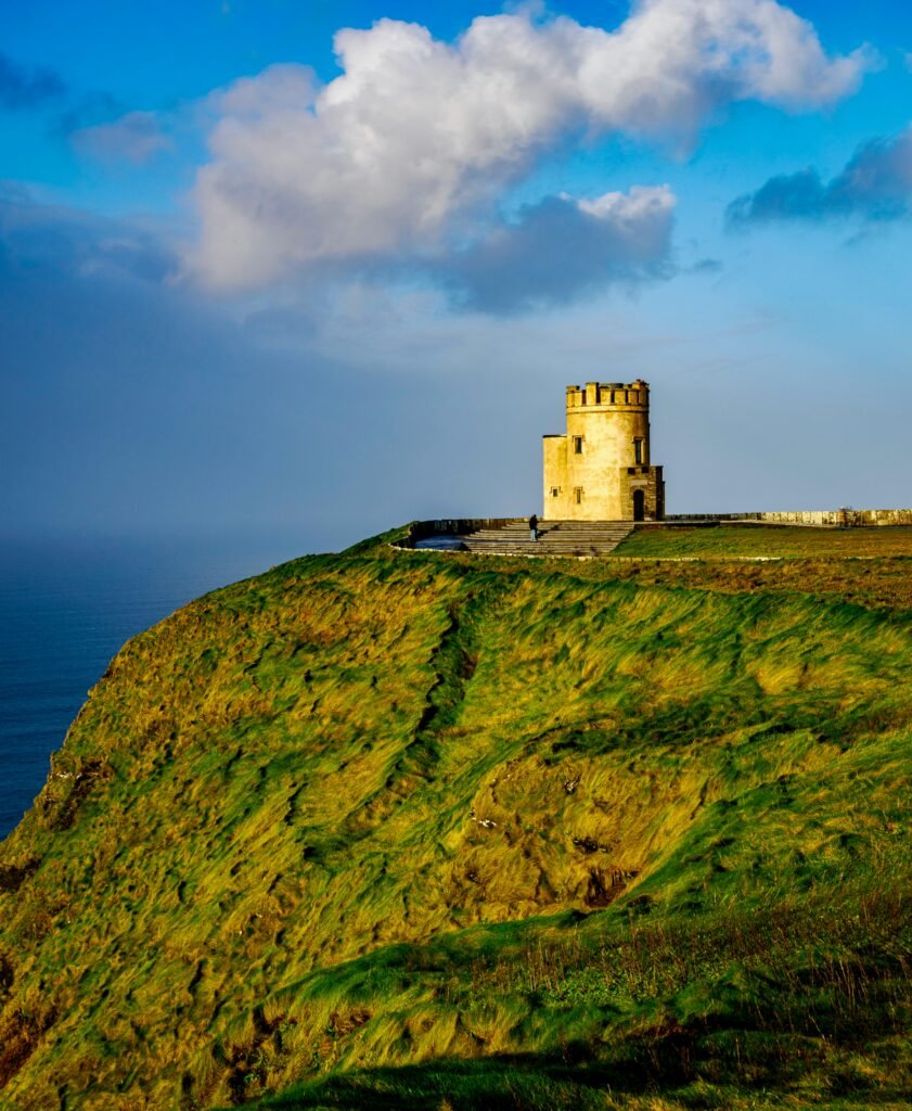 pexels photo 22882551 22882551 Majestic view of O'Brien's Tower at Cliffs of Moher, County Clare, Ireland, under a vibrant sky.